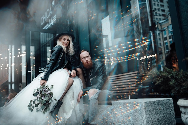 full length of couple on illuminated city at night
