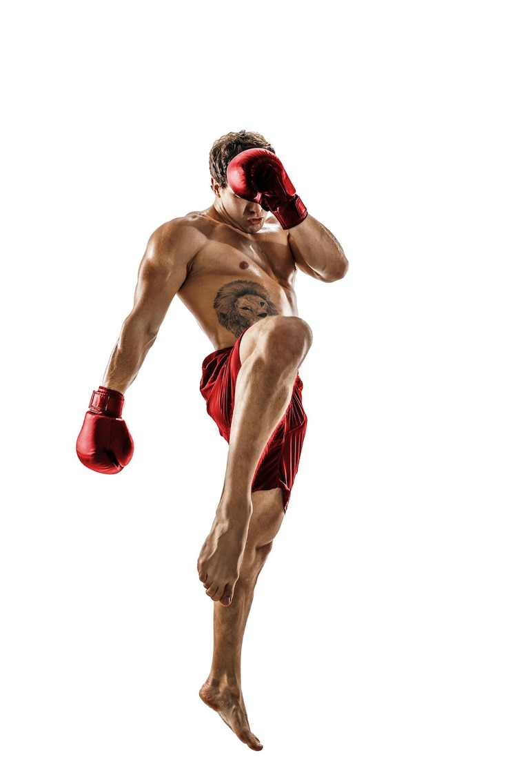 Fotografie full size of professional kickboxer in red sportswear on white background muscular athlete fighting