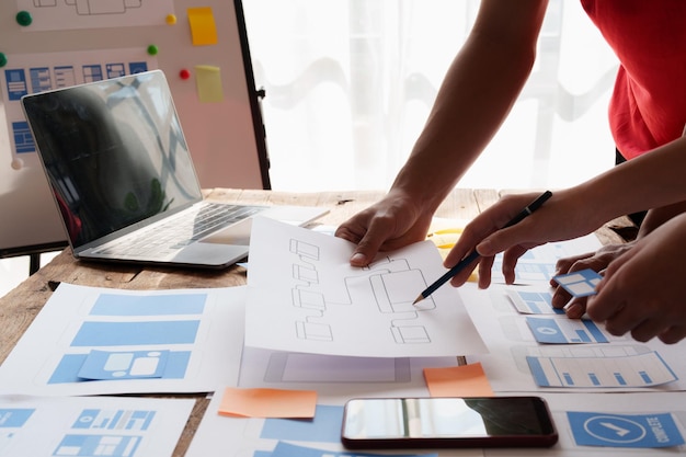 Group of ux developer and ui designer brainstorming about app interface design at modern office Creative digital development agency