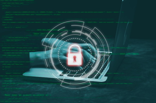 hacker hand using keyboard typing bad data into laptop computer online system