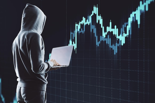 hacker holding laptop with finance and data protection interface