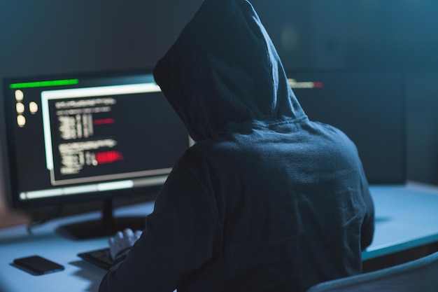 hacker using computer virus for cyber attack