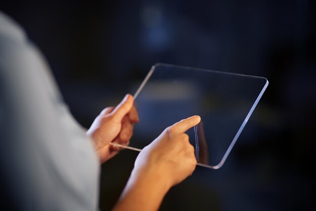 hands with transparent tablet pc computer