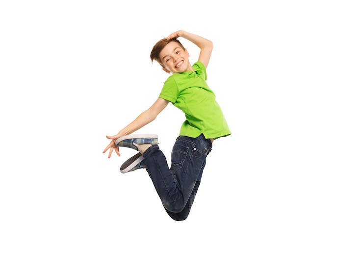 Fotografie happiness, childhood, freedom, movement and people concept - smiling boy jumping in air