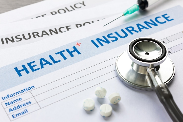Fotografie health insurance form with stethoscope