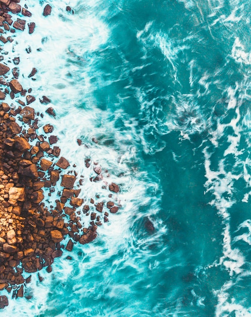 high angle view of rocks by sea