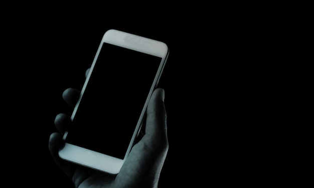 human hand hold a smartphone with a blank screen