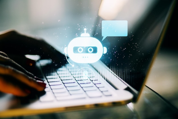 Human hands typing on a laptop keyboard with chatbot hologram