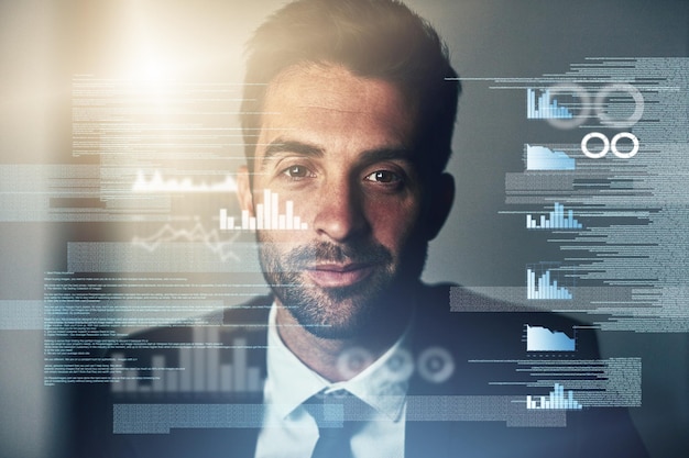 Immersed in the code Cropped portrait of a handsome young businessman coding late in the office