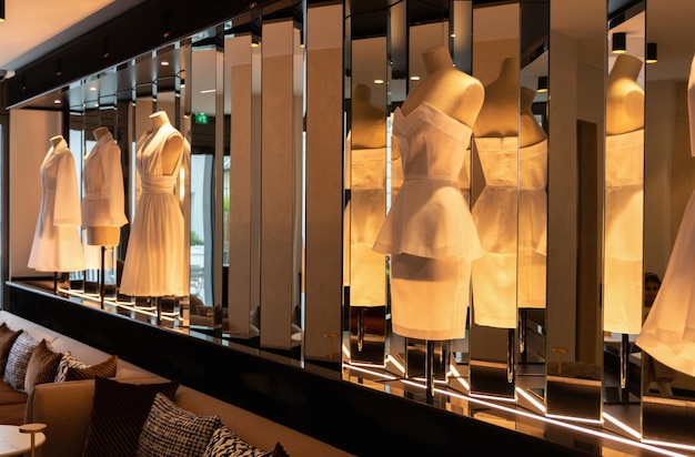 interior with mannequins dressed in white dresses