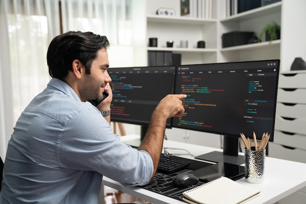 it developer calling to coworker solving problem coding system on pc surmise