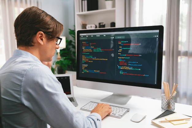 it developer working online software development on pc and laptop pecuniary