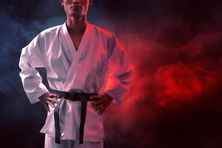 Fotografie karate martial arts fighter on dark background