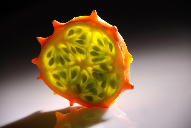 kiwano or african horned melon . also known as hedged gourd, african horned cucumber, english tomato