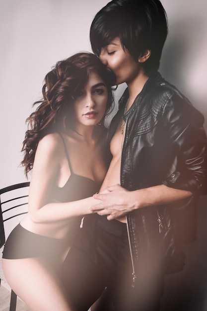 lesbians romancing against white background