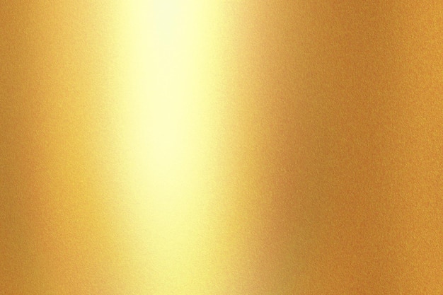 Light shining on gold painted metal wall with copy space abstract texture background