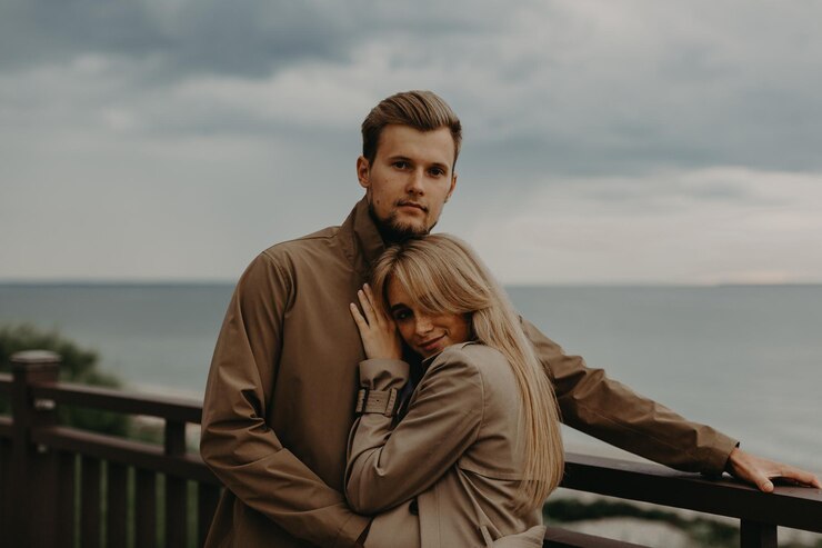 Fotografie love story of a young boy and girl solitude with the sea one on one baltic sea  sylt-ost germany