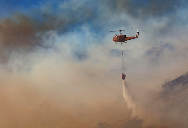 low angle view of helicopter against sky