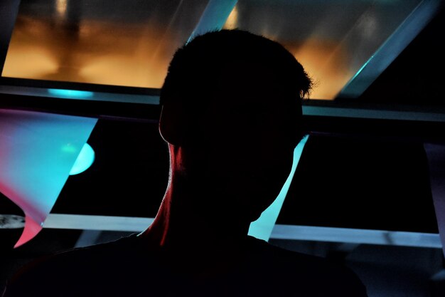 low angle view of man in darkroom at night