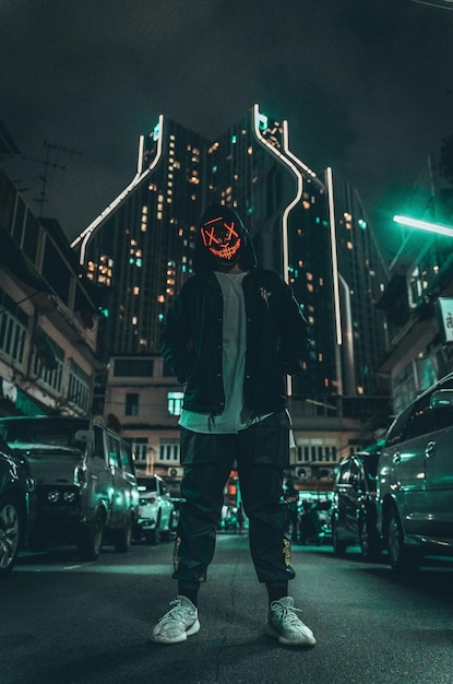 Low angle view of man wearing mask standing on street
