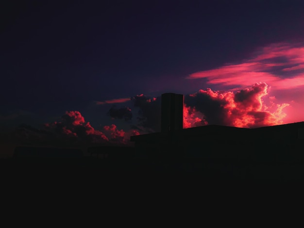 low angle view of smoke from smoke stack at night