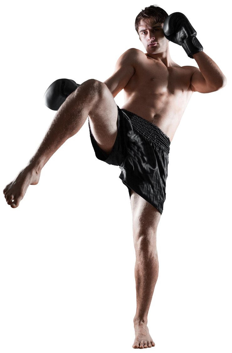 Fotografie male boxer , kickboxer performing a kick