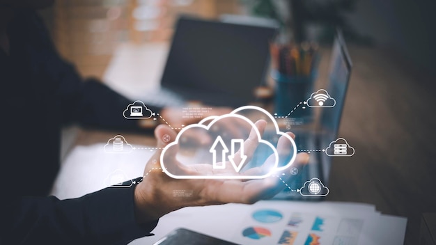 Man with cloud computing diagram show on hand Cloud technology Data storage Networking and internet service concept