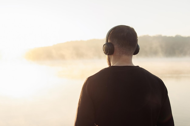 man with headphones listening to music wireless headphones