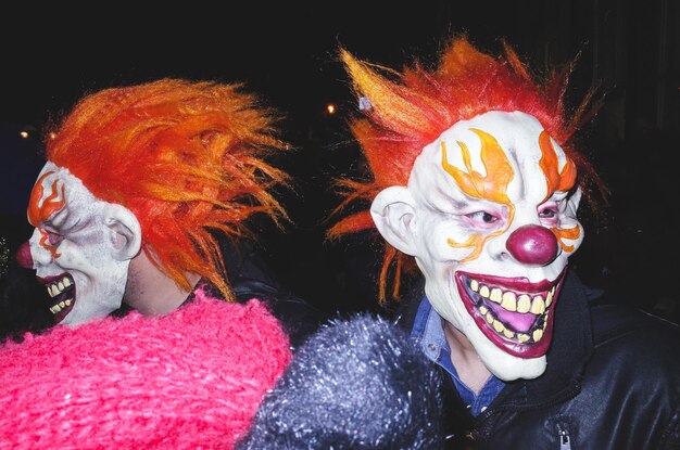 men in clown mask at night