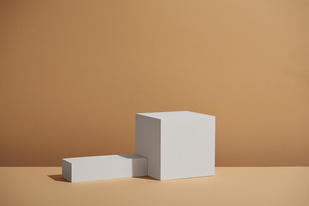 minimalist white catwalks against a warm beige background for product display