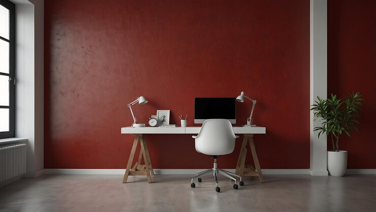 Modern minimalist home office workspace with red wall