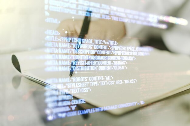 Multi exposure of abstract programming language hologram with man hand writing in notepad on background artificial intelligence and machine learning concept