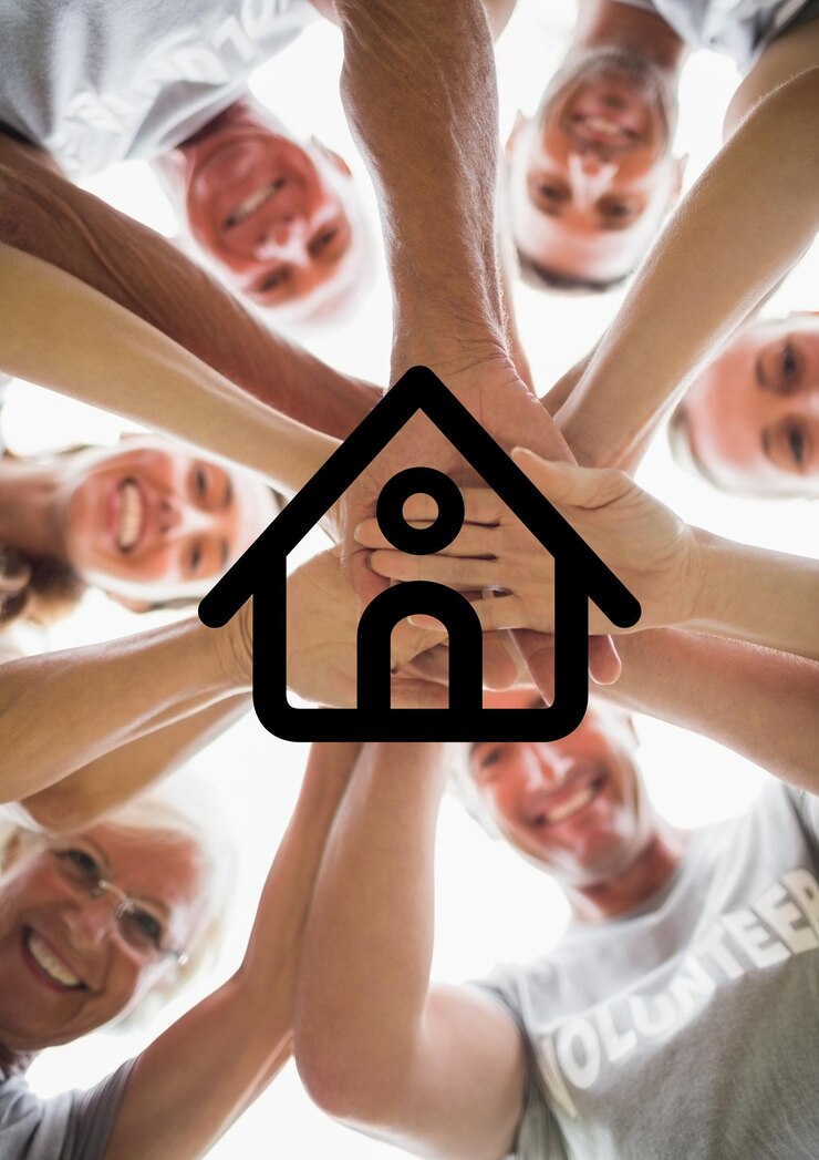 Fotografie multigeneration family with their hands stacked against house outline in background