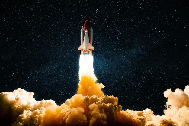 New technological shuttle rocket with blast fire and smoke successfully takes off into the starry sky Spaceship launches into dark space with stars Science and transport concept