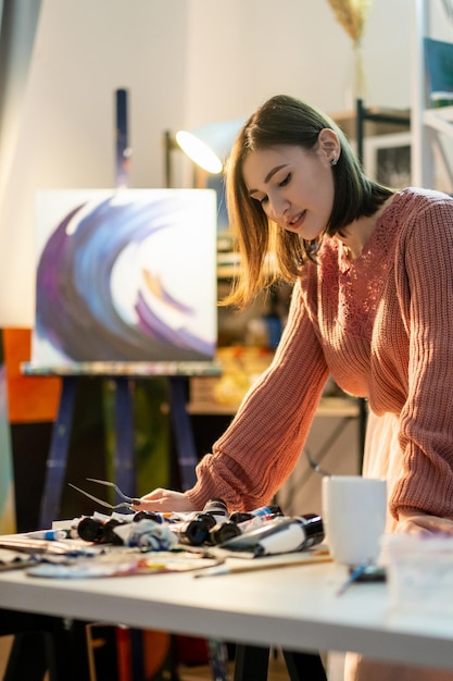 Painting hobby modern art artist woman in studio