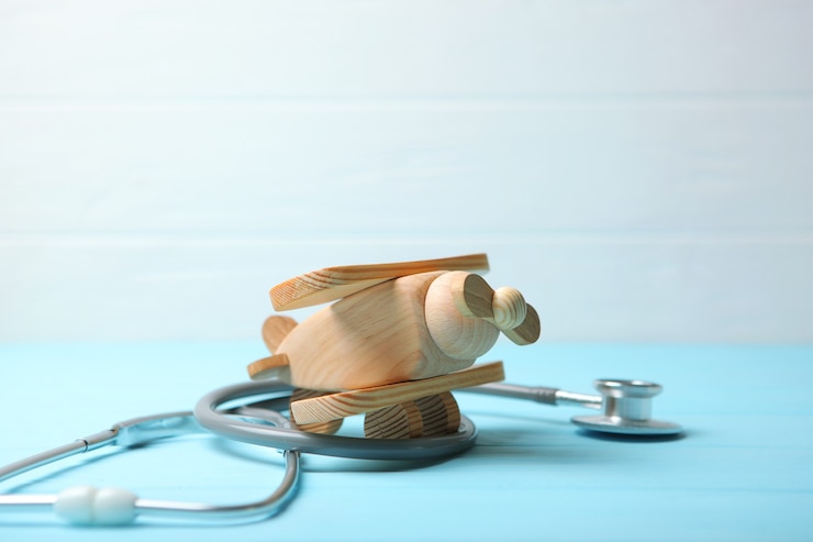 Fotografie pediatrics concept stethoscope and toy on a light background