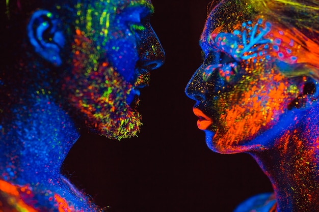 portrait of a pair of lovers painted in fluorescent powder.