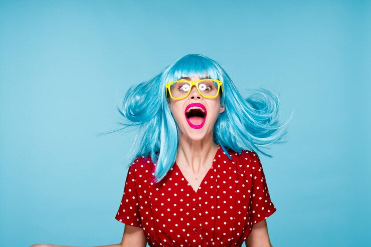 Fotografie portrait of young woman against blue background