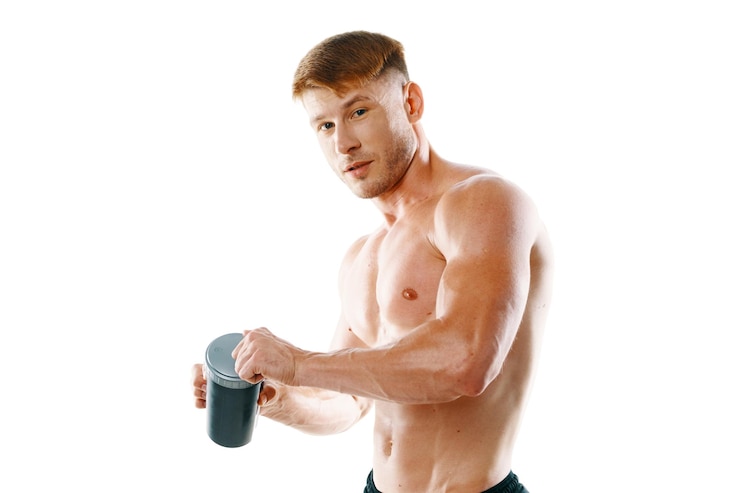 Fotografie portrait of young woman exercising against white background