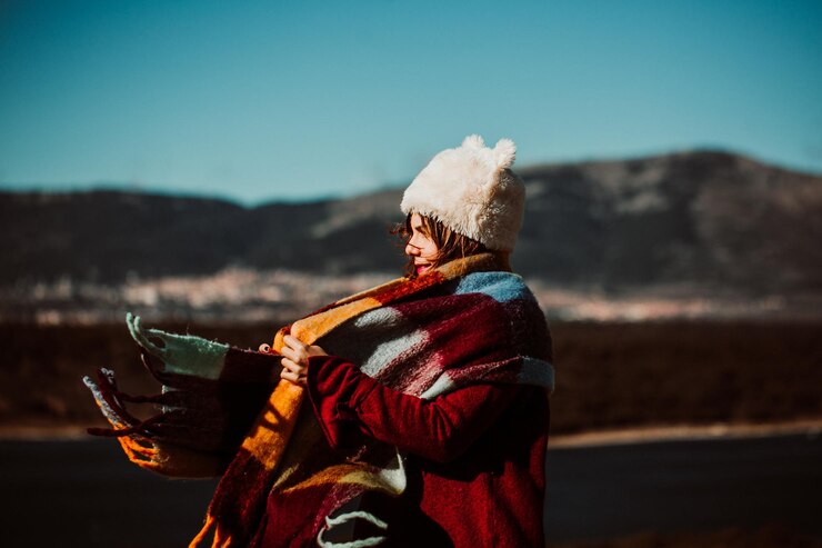 Fotografie rear view of woman looking at mountain during winter