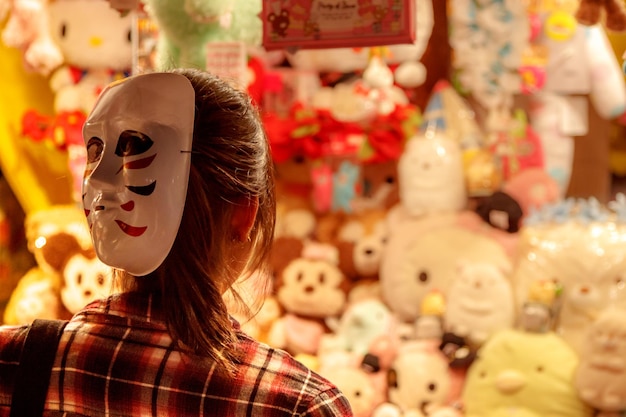 Rear view of woman wearing mask