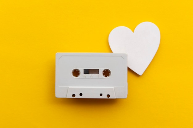 retro audio cassette tape surrounded by white love hearts.