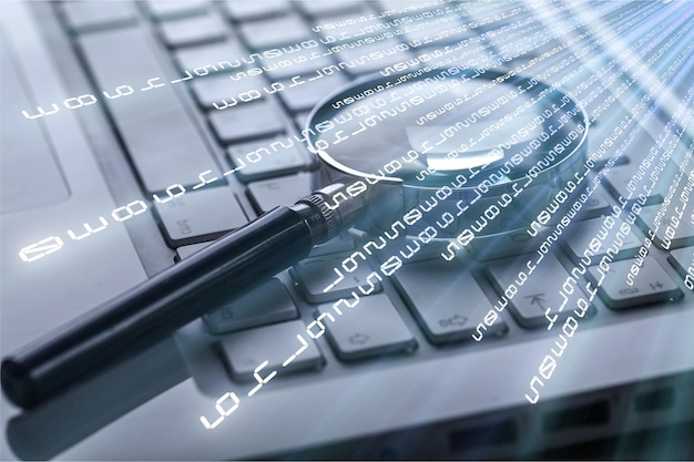 selective focus on keyboard with magnifier searching concept in dark low key night tone