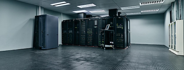server room empty or data center for internet connection computing network or cyber security hardware it support background information technology or machine equipment with laptop in a datacenter