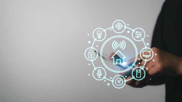 smart home concept view of a home button of a technology interface surrounded by application technology app concept