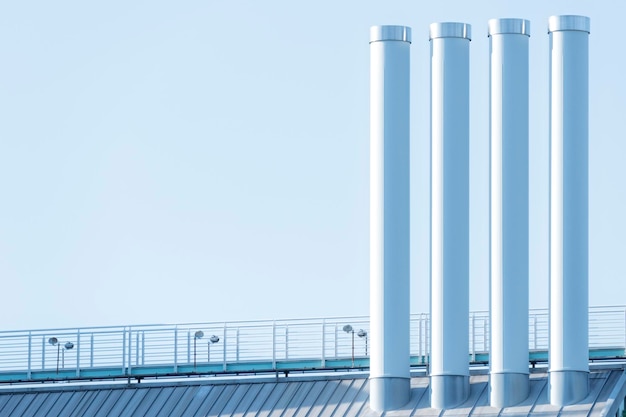smoke stacks against clear sky