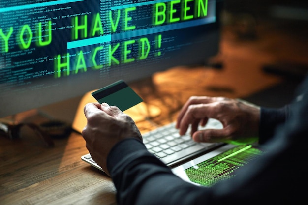 Someone is in for a nasty surprise Cropped shot of an unidentifiable hacker cracking a computer code in the dark