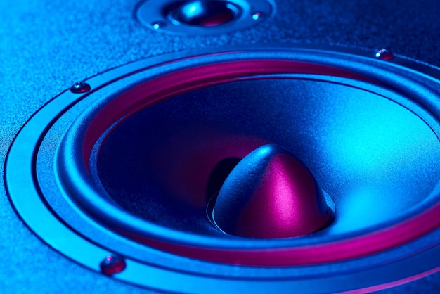 Sound audio speaker with neon lights dynamic monitor closeup creative backgroound