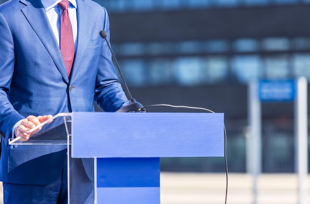 Speaker at press conference corporate presentation company meeting public or political event