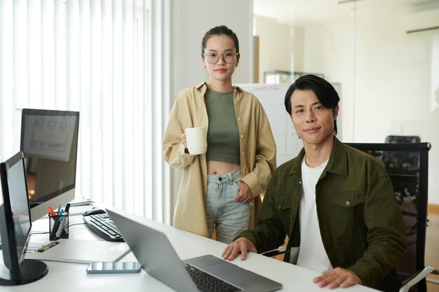 Team of young software developers working in office